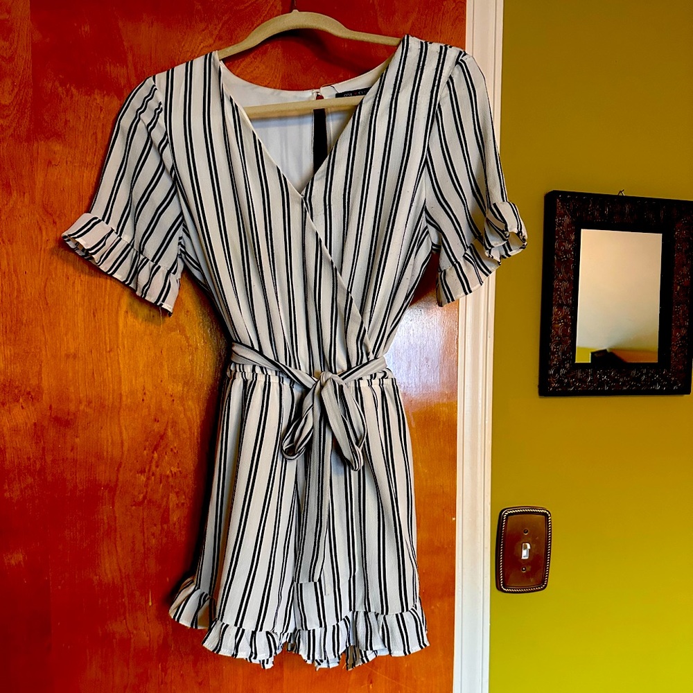 Navy blue and white striped one-piece shorts set.